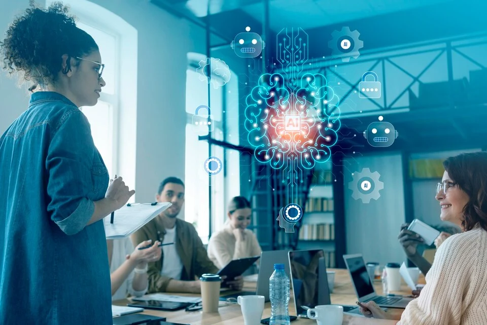 Corporate professionals in a board meeting with one employee presenting a hologram of digitization through AI and AI Agents