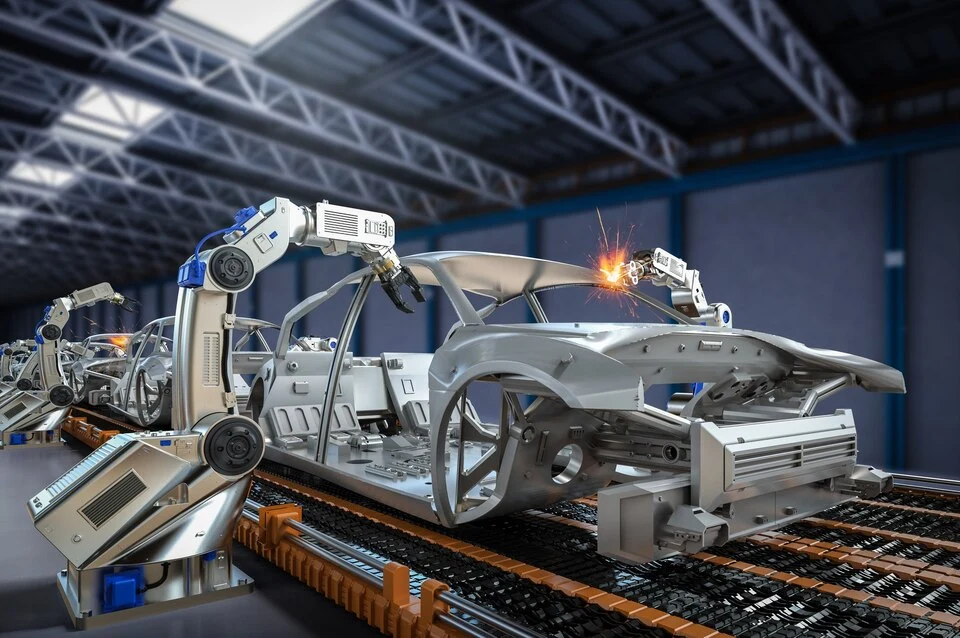 Robots manufacturing a car in an autmomotive factory depicting how RPA companies in India have transformed modern day automotive Manufacturing
